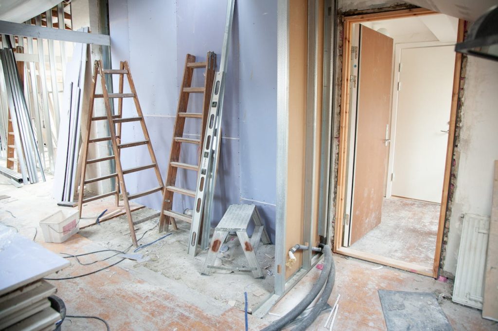 Crafting Captivating Headlines: Your awesome post title goes here Construction site featuring ladders and tools in a home renovation setting.